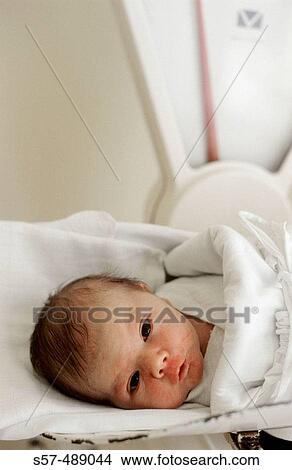 Picture - New born baby in maternity hospital. Fotosearch