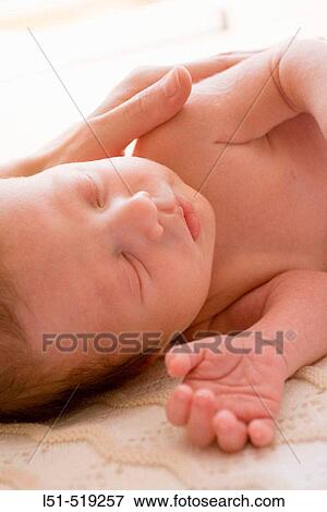 New born baby sleeping in the sun. View Large Photo Image Stock Photo - New born baby sleeping in the sun.. Fotosearch