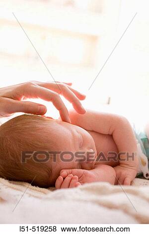 New born baby sleeping in the sun. View Large Photo Image Stock Photo - New born baby sleeping in the sun.. Fotosearch
