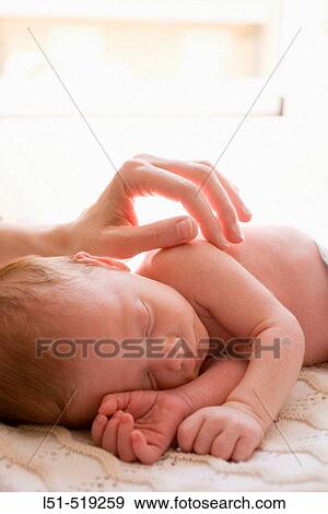 New born baby sleeping in the sun. View Large Photo Image Stock Photo - New born baby sleeping in the sun.. Fotosearch