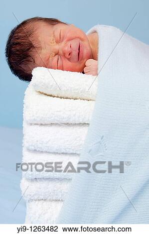 Stock Image - New born on soft towels. Fotosearch