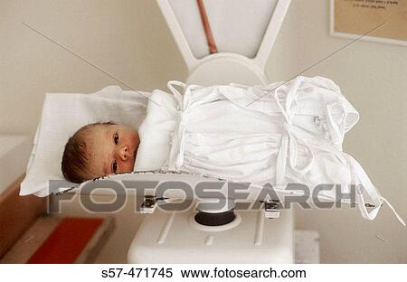 new born (two days old) baby-girl on scales in maternity hospital View Large Photo Image Stock Photography - new born (two days old) baby-girl on scales in maternity hospital. Fotosearch