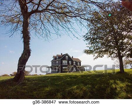 New England house on Block Island, a coastal island that is part of Rhode Island. View Large Photo Image Stock Photo - New England house on Block Island, a coastal island that is part of Rhode Island.. Fotosearch