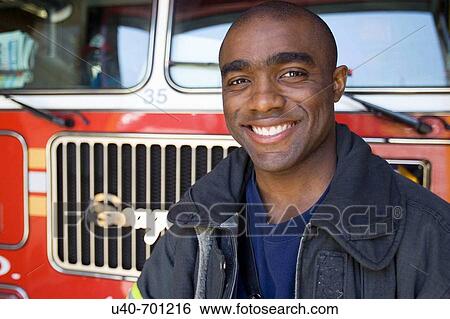 Stock Photograph - New York City Fireman. Fotosearch