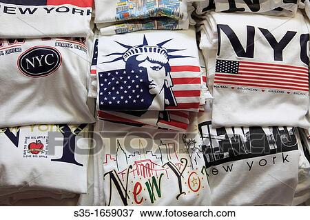 New York City souvenir shirts for sale in a gift shop Manhattan New York City USA. View Large Photo Image Stock Photo - New York City souvenir shirts for sale in a gift shop Manhattan New York City USA.. Fotosearch