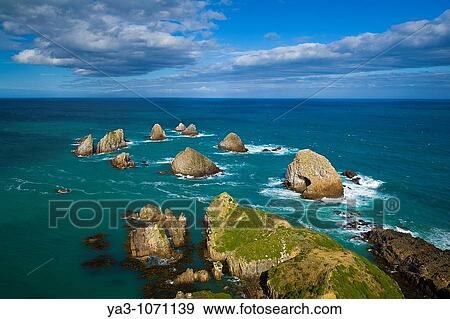 New Zealand, Southland, The Catlins Nugget Point, located at the northern end of the Catlins coast View Large Photo Image Stock Photo - New Zealand, Southland, The Catlins Nugget Point, located at the northern end of the Catlins coast. Fotosearch