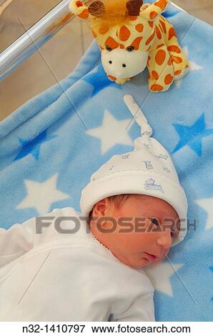 Newborn baby boy at hospital nursery, 1 day old View Large Photo Image Stock Photo - Newborn baby boy at hospital nursery, 1 day old. Fotosearch