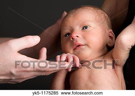 Newborn Baby Boy with his mother and father View Large Photo Image Stock Photography - Newborn Baby Boy with his mother and father. Fotosearch