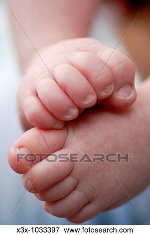 Newborn baby curled up feet View Large Photo Image Stock Photo - Newborn baby curled up feet. Fotosearch