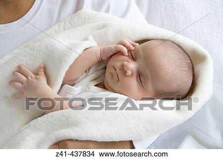 Newborn baby in blanket View Large Photo Image Picture - Newborn baby in blanket. Fotosearch