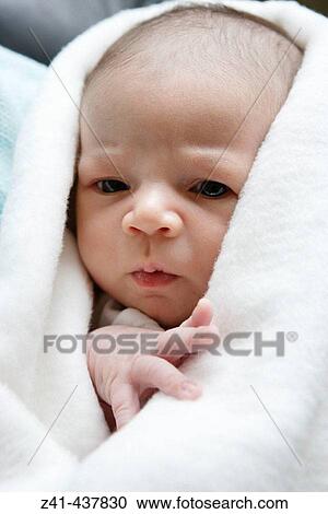 Stock Image - Newborn baby in blanket. Fotosearch