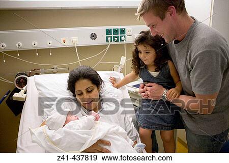 Newborn baby with family in hospital View Large Photo Image Stock Photo - Newborn baby with family in hospital. Fotosearch
