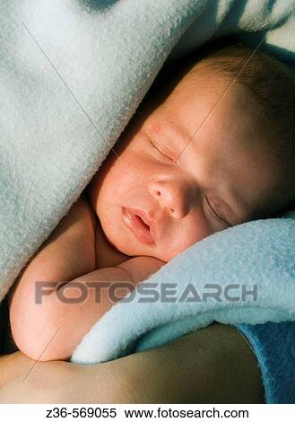 Stock Photography - Newborn girl sleeping. Fotosearch