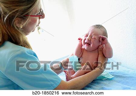 Stock Photograph - Newborn, Nurse Care, Maternity, Donostia Hospital, San Sebastian, Donostia, Gipuzkoa, Basque Country, Spain. Fotosearch