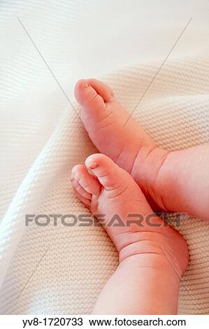 Newborn's tiny feet View Large Photo Image Stock Image - Newborn's tiny feet. Fotosearch