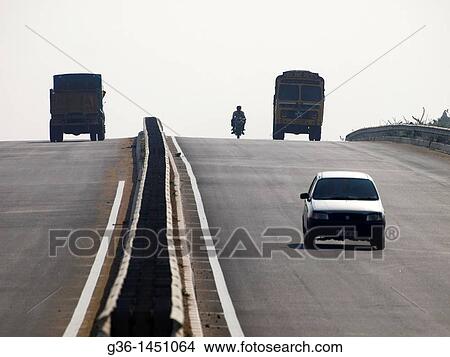 Newly built roads, part of the national higway system, in rural Taml Nadu, India View Large Photo Image Picture - Newly built roads, part of the national higway system, in rural Taml Nadu, India. Fotosearch