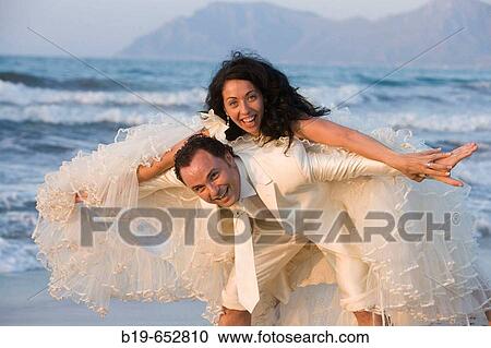 Newly married couple on the beach. View Large Photo Image Stock Image - Newly married couple on the beach.. Fotosearch