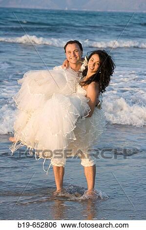 Newly married couple on the beach. View Large Photo Image Stock Photograph - Newly married couple on the beach.. Fotosearch