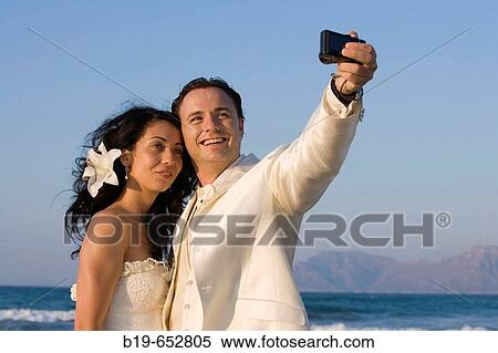 Newly married couple on the beach. View Large Photo Image Stock Photography - Newly married couple on the beach.. Fotosearch