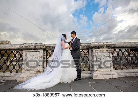 Newlyweds at Castel Sant? Angelo bridge Rome Italy View Large Photo Image Stock Photo - Newlyweds at Castel Sant? Angelo bridge Rome Italy. Fotosearch