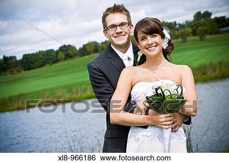 Newlyweds, Bride and Groom, outdoor portraits View Large Photo Image Stock Photograph - Newlyweds, Bride and Groom, outdoor portraits. Fotosearch