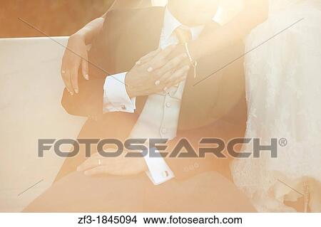 Newlyweds holding their hands View Large Photo Image Picture - Newlyweds holding their hands. Fotosearch