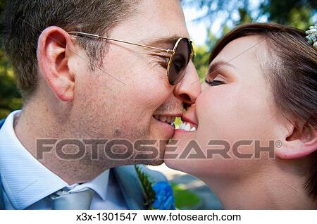 Newlyweds kissing View Large Photo Image Stock Photo - Newlyweds kissing. Fotosearch