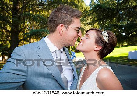 Newlyweds kissing View Large Photo Image Stock Photograph - Newlyweds kissing. Fotosearch