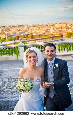 Newlyweds together in front of the Roman skyline Gianicolo, Rome, Italy View Large Photo Image Stock Image - Newlyweds together in front of the Roman skyline Gianicolo, Rome, Italy. Fotosearch