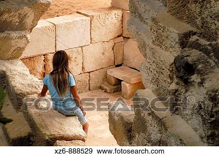 Stock Photo - Nia sola entre las piedras Girl alone among the rocks L? thica, pedreres de s? Hostal, Menorca, Balears, Spain, Europe. Fotosearch