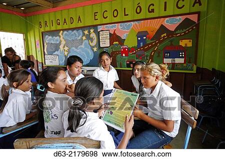 Stock Photo - Nicaragua. CANTERA projects. Fray Jesus de Pamplona primary school at Los Planes de Cuajachillo. Ecology Brigade which teaches children to care for the environment. Children working among themselves.. Fotosearch