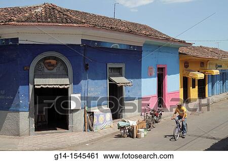 Nicaragua, Granada, Calle Vega, colonial heritage, neighborhood, street scene, corner, building, business, colorful, cyclist, Hispanic, man, roof tiles, View Large Photo Image Stock Image - Nicaragua, Granada, Calle Vega, colonial heritage, neighborhood, street scene, corner, building, business, colorful, cyclist, Hispanic, man, roof tiles,. Fotosearch