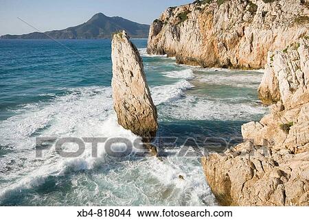 ? Nido d? aquila? (eagle's nest) cliff, Buggerru, Sardinia, Italy View Large Photo Image Picture - ? Nido d? aquila? (eagle's nest) cliff, Buggerru, Sardinia, Italy. Fotosearch