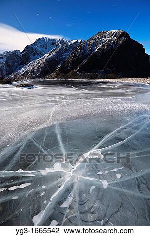 Night image of crack in frozen lake Nedre Heimdalsvatnet, Eggum, Lofoten Islands, Norway View Large Photo Image Stock Image - Night image of crack in frozen lake Nedre Heimdalsvatnet, Eggum, Lofoten Islands, Norway. Fotosearch