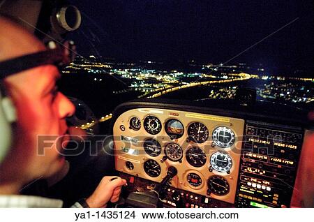 Night VFR flight in a small plane Cessna 172 over Luxembourg town View Large Photo Image Picture - Night VFR flight in a small plane Cessna 172 over Luxembourg town. Fotosearch