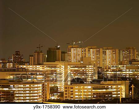 Night view of the public housing in Singapore with cranes in the background View Large Photo Image Stock Image - Night view of the public housing in Singapore with cranes in the background. Fotosearch