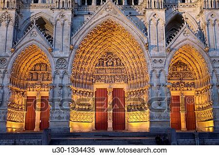 Night view Ornate doorway of the Cathedral of Notre Dame, from XIII Century, in Amiens listed as World Heritage by UNESCO It's the Highest ghotic cathedral of France View Large Photo Image Stock Photography - Night view Ornate doorway of the Cathedral of Notre Dame, from XIII Century, in Amiens listed as World Heritage by UNESCO It's the Highest ghotic cathedral of France. Fotosearch