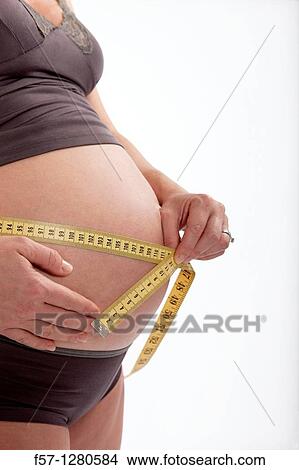 Nine months pregnant mother to be View Large Photo Image Picture - Nine months pregnant mother to be. Fotosearch