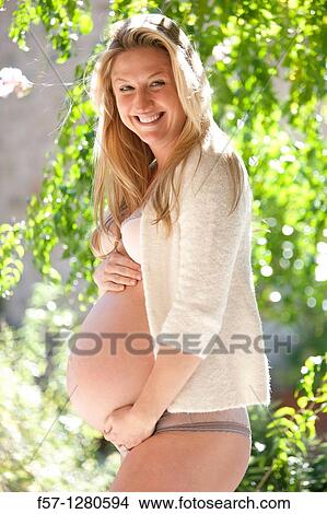 Nine months pregnant mother to be View Large Photo Image Picture - Nine months pregnant mother to be. Fotosearch