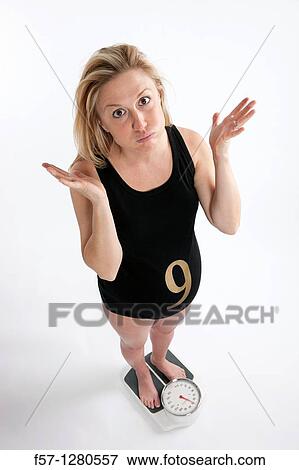 Nine months pregnant mother to be View Large Photo Image Stock Photo - Nine months pregnant mother to be. Fotosearch