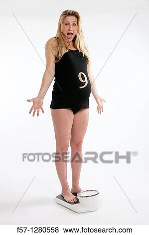 Nine months pregnant mother to be View Large Photo Image Stock Photo - Nine months pregnant mother to be. Fotosearch