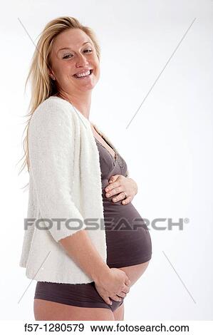 Stock Photo - Nine months pregnant mother to be. Fotosearch