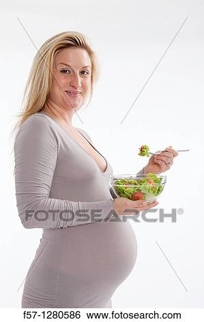 Stock Photograph - Nine months pregnant mother to be. Fotosearch