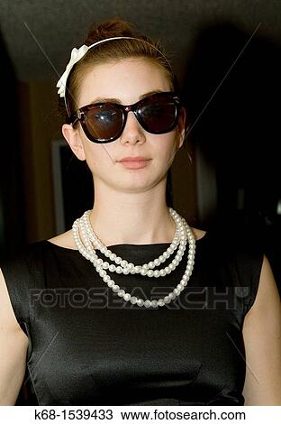 nineteen year old girl in black dress and sunglasses View Large Photo Image Stock Image - nineteen year old girl in black dress and sunglasses. Fotosearch