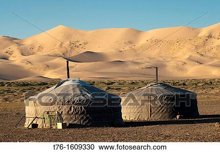 nomadic gers under the sand dunes of Khongoryn Els at sunset in the Gobi Desert of Mongolia View Large Photo Image Stock Image - nomadic gers under the sand dunes of Khongoryn Els at sunset in the Gobi Desert of Mongolia. Fotosearch