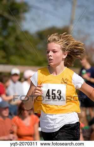 North America, Canada, Ontario, girl running in race. View Large Photo Image Stock Image - North America, Canada, Ontario, girl running in race.. Fotosearch