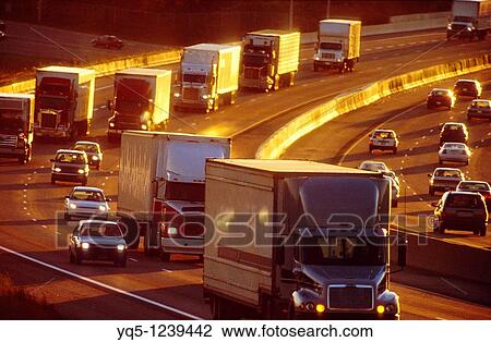 Stock Image - North America, Canada, Ontario, Mississauga, trucks on highway. Fotosearch