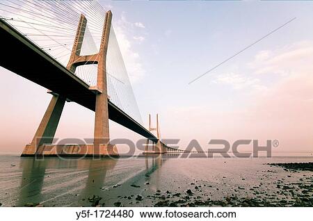 North towers of Vasco da Gama bridge on low tide View Large Photo Image Stock Image - North towers of Vasco da Gama bridge on low tide. Fotosearch