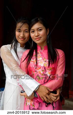NORTH VIETNAM, HANOI, TEMPLE OF LITERATURE, DEDICATED TO CONFUCIUS, COLLEGE STUDENTS TAKING GRADUATION PHOTOS, GIRLS WEARING TRADITIONAL DRESS 'AO DAI', PORTRAIT. View Large Photo Image Stock Image - NORTH VIETNAM, HANOI, TEMPLE OF LITERATURE, DEDICATED TO CONFUCIUS, COLLEGE STUDENTS TAKING GRADUATION PHOTOS, GIRLS WEARING TRADITIONAL DRESS 'AO DAI', PORTRAIT.. Fotosearch