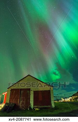 Stock Image - Northern lights above small village of Bleidabollstadur, Vatnajokull National Park, Iceland.. Fotosearch